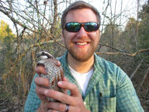 Jacob McClain holds a northern bobwhite quail.